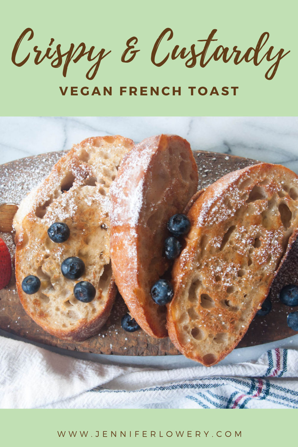 Pinterest pin of vegan french toast slices on a wooden board with berries